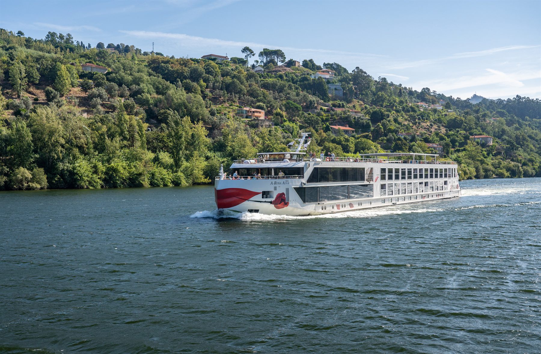 A river cruise boat on the terraced Douro in Portugal